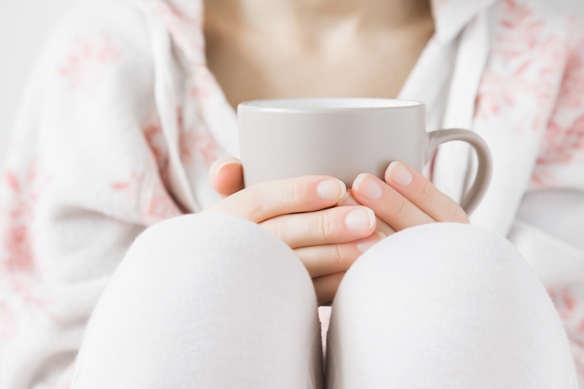 Woman,In,White,Soft,Home,Sweater,Holding,A,Mug,In